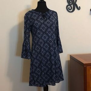 Mid-length patterned dress with bell sleeves